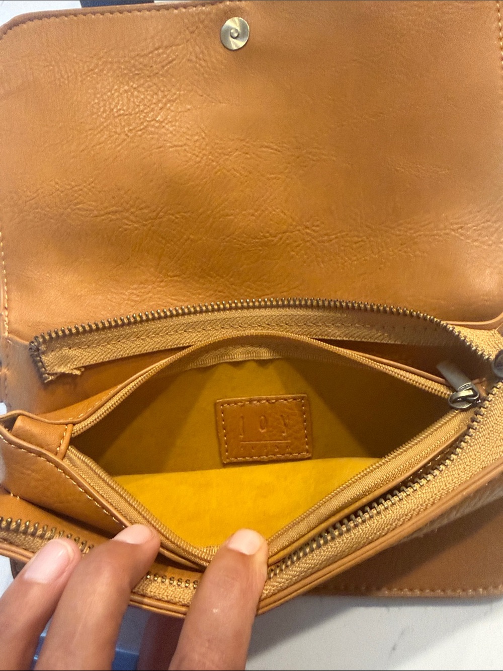 Joy Susan tan leather crossbody with yellow interior